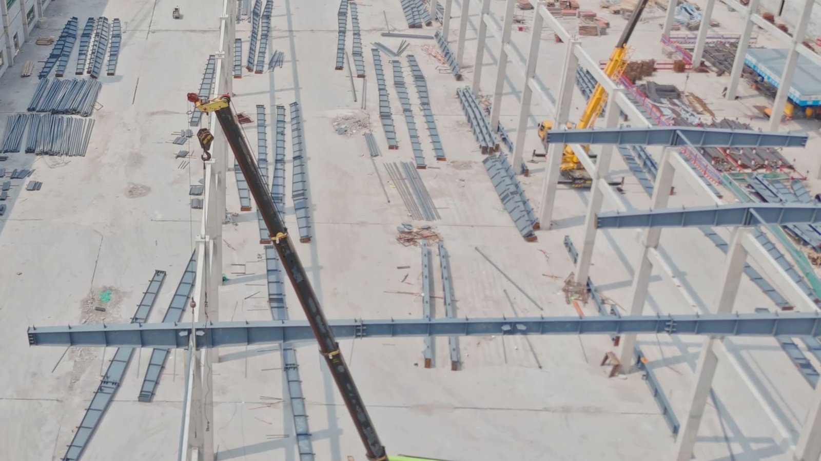 Aerial view of a construction site with tower cranes